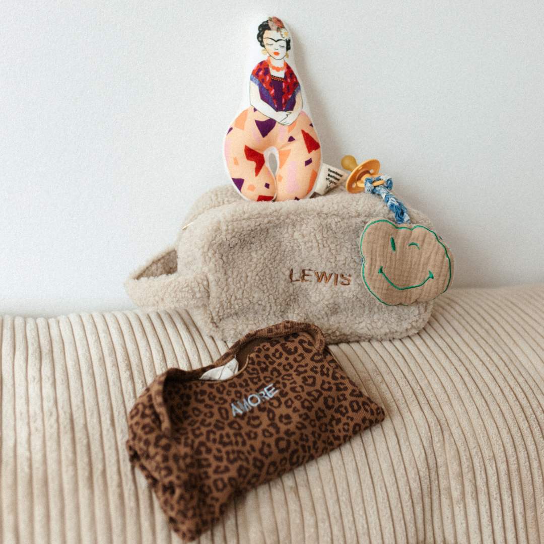 Rammelaar, etui, romper en speendoek