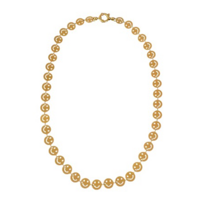 Een gouden ketting met smiley erop
