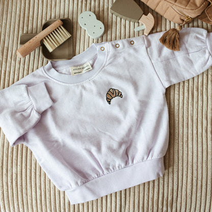 lila sweater met icoon 