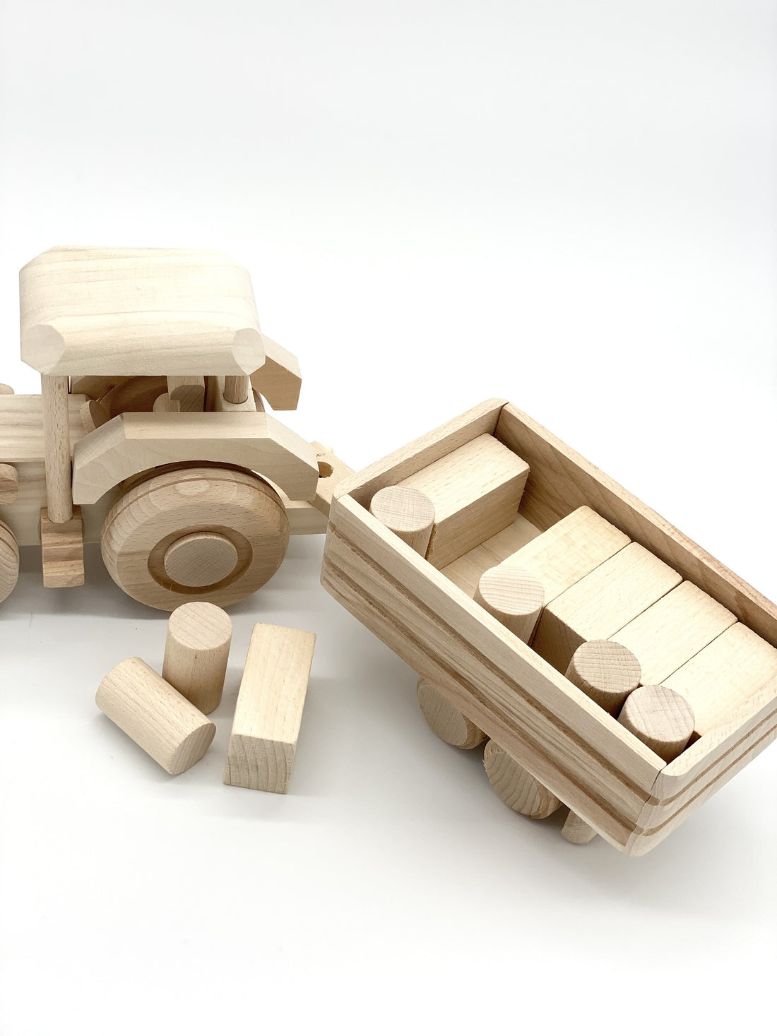 GIANT TRACTOR WITH TRAILER AND WOODEN BLOCKS